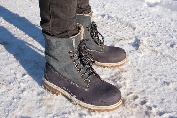 Small grey woman shoes on snow with shadows. Harsh winter — Stock Photo, Image