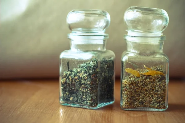 Dried spices or herbs picked in Spring and Summer in white decorative jars