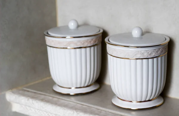 Two white decorative porcelain cups or containers with lids. Sty — Stock Photo, Image