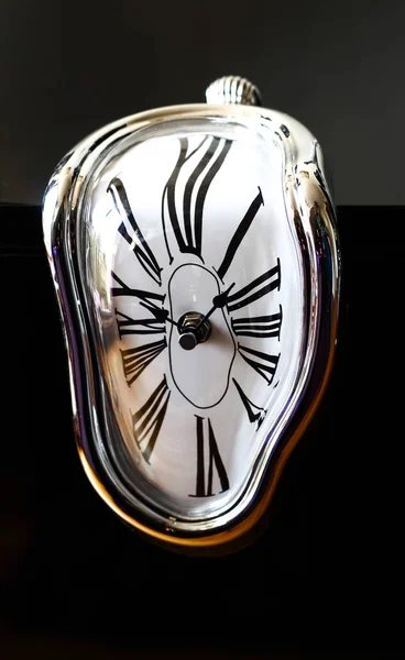 Distorted photograph of a surreal watch over black background. D — Stock Photo, Image