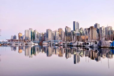 Vancouver skyline and reflection in water.  clipart