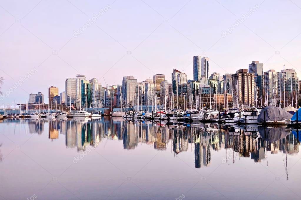 Vancouver skyline and reflection in water. 