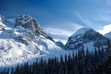 Canadian Rockies in winter. Fresh snow in mountaisn. Plain of Six Glaciers hiking trail in Banff National Park. Alberta. Canada. clipart