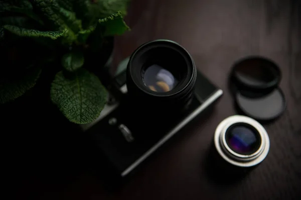 Vintage camera on a wooden table — Stock Photo, Image