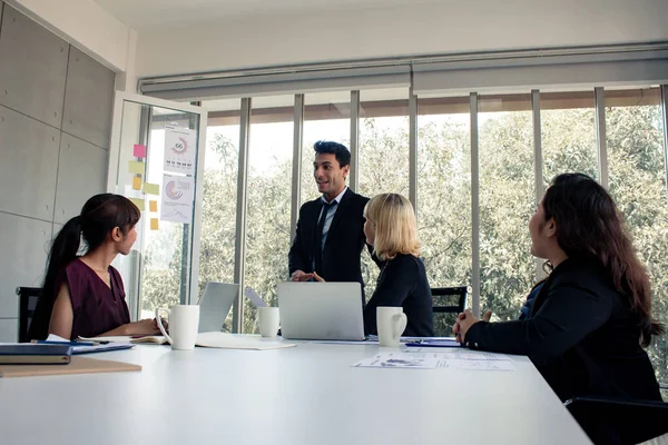 Men with explaining the information in meeting room. — Stockfoto