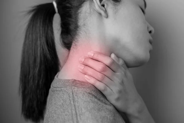 Woman with pain in neck. Concept woman suffering from pain in neck.
