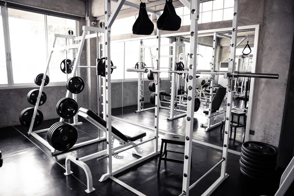 Within gym with modern fitness equipment for fitness events and more. Modern of gym interior with equipment. Sports equipment in the gym.