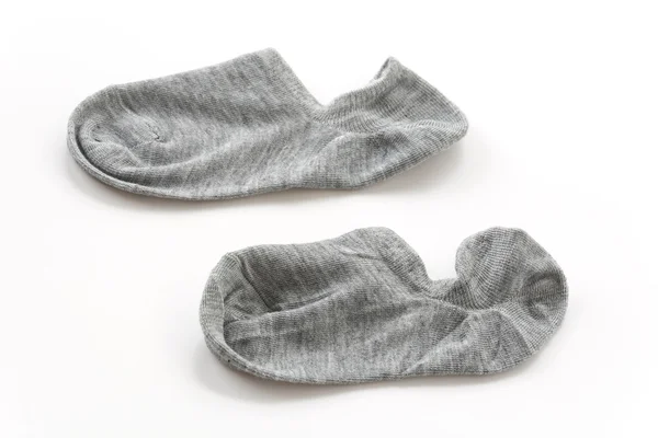 Šedé ponožky na bílém pozadí — Stock fotografie