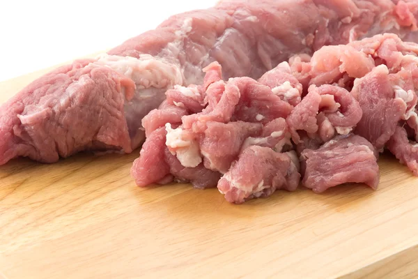 Carne de porco de fatia na placa de madeira — Fotografia de Stock