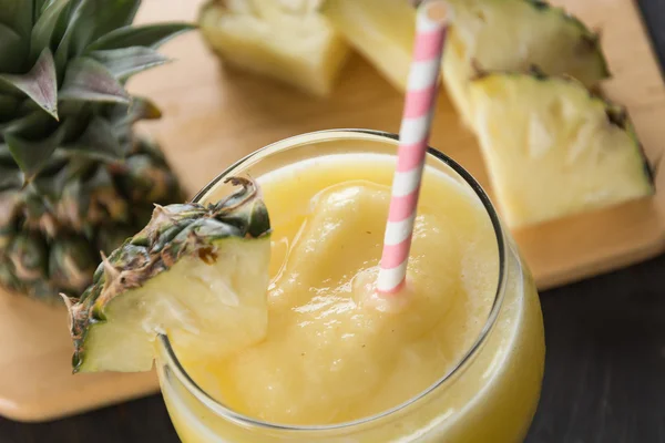 Pineapple smoothie on wood background — Stock Photo, Image