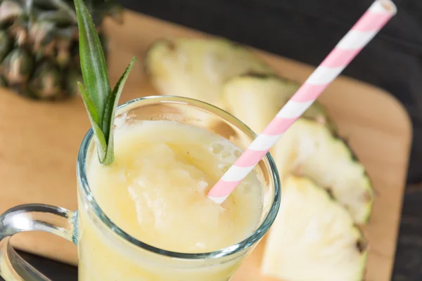 Pineapple smoothie on wood background — Stock Photo, Image