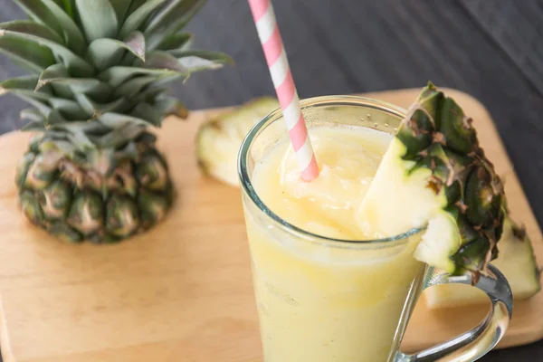 Pineapple smoothie on wood background — Stock Photo, Image