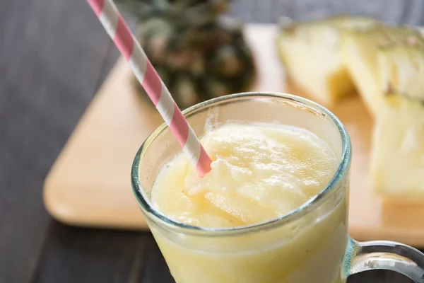 Pineapple smoothie on wood background — Stock Photo, Image