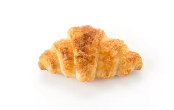 Máslo croissant na bílém pozadí — Stock fotografie