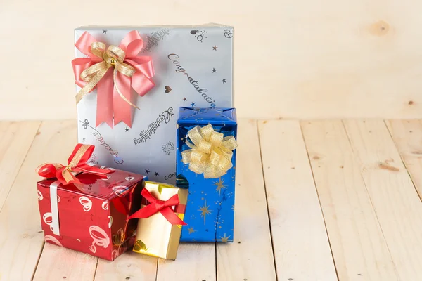 Gift box on wood background — Stock Photo, Image