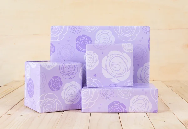 Gift box on wood background — Stock Photo, Image