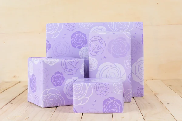 Gift box on wood background — Stock Photo, Image