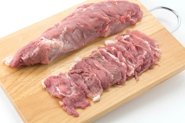 Carne de porco de fatia na placa de madeira — Fotografia de Stock