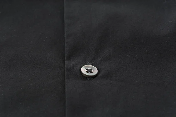 Кнопка закрытия на рубашке — стоковое фото