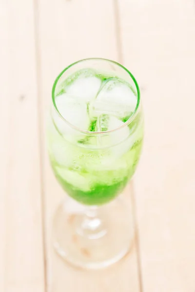 Green soda on wood — Stock Photo, Image