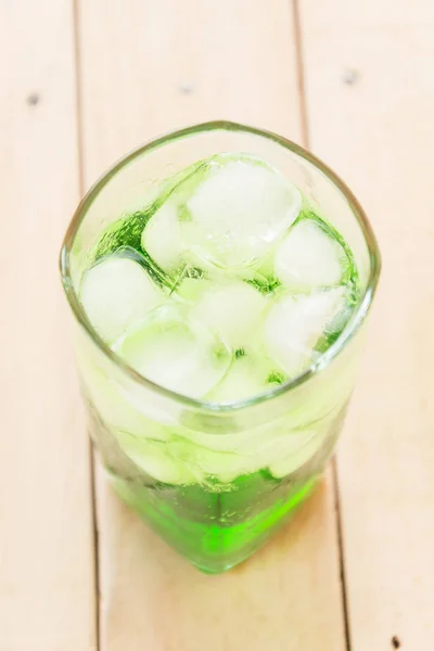 Green soda on wood — Stock Photo, Image