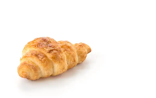 Smör croissant på vit bakgrund — Stockfoto