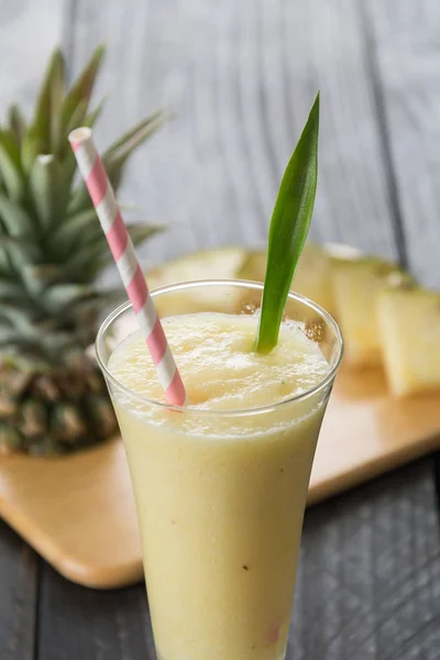 Pineapple smoothie on wood background — Stock Photo, Image