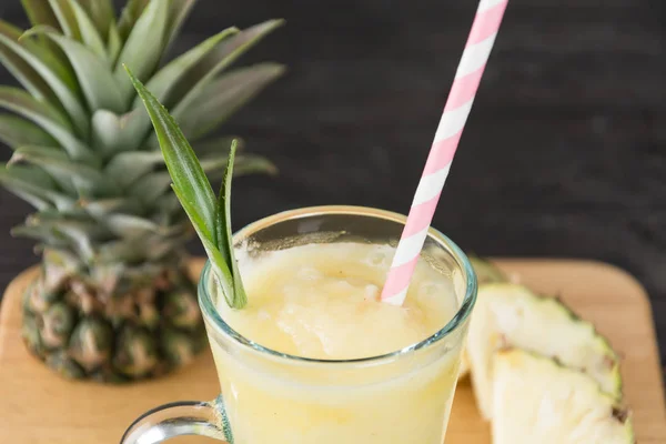 Pineapple smoothie on wood background — Stock Photo, Image