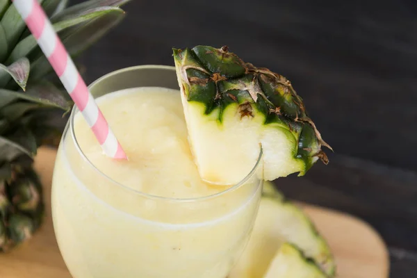 Pineapple smoothie on wood background — Stock Photo, Image