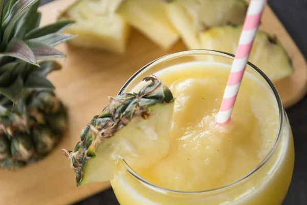 Pineapple smoothie on wood background — Stock Photo, Image