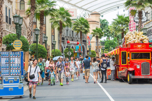 SINGAPORE - JULY 20: Tourists and theme park visitors taking pic