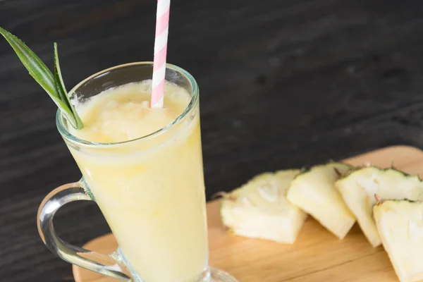 Pineapple smoothie on wood background — Stock Photo, Image