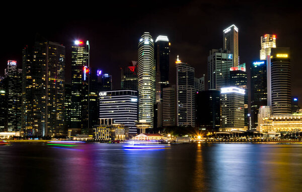 SINGAPORE, SINGAPORE - JULY 19 2015: View of downtown Singapore city at night. Singapore is one of the world's major commercial hubs