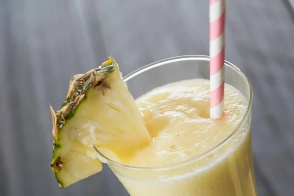 Pineapple smoothie on wood background — Stock Photo, Image