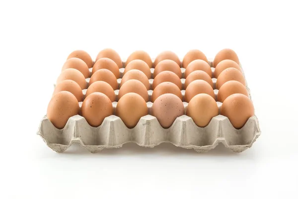 Huevos de gallina con panel sobre fondo blanco —  Fotos de Stock
