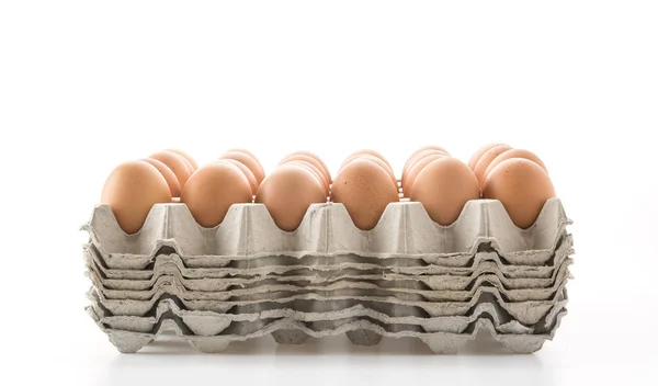 Huevos de gallina con panel sobre fondo blanco —  Fotos de Stock