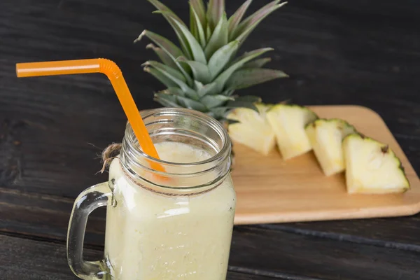 Pineapple smoothie on wood background — Stock Photo, Image