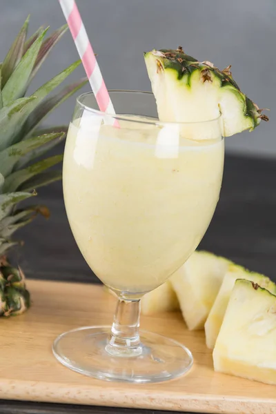 Pineapple smoothie on wood background — Stock Photo, Image