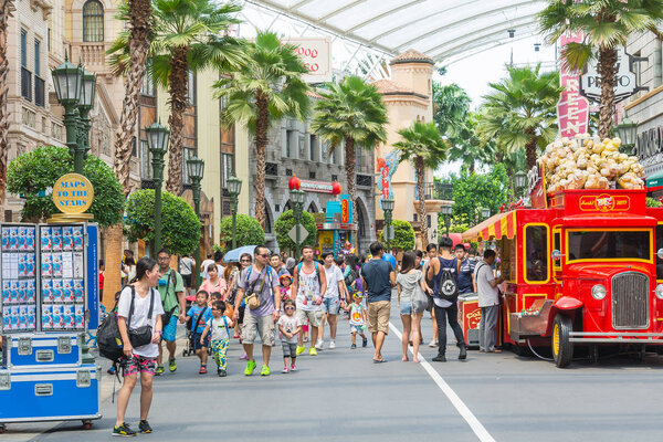 SINGAPORE - JULY 20: Tourists and theme park visitors taking pic
