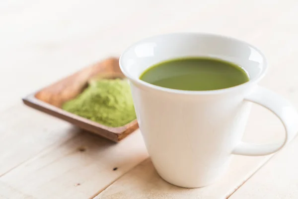 stock image hot matcha on wood background