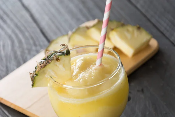 Pineapple smoothie on wood background — Stock Photo, Image