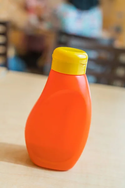 sauce bottle on table in restaurant