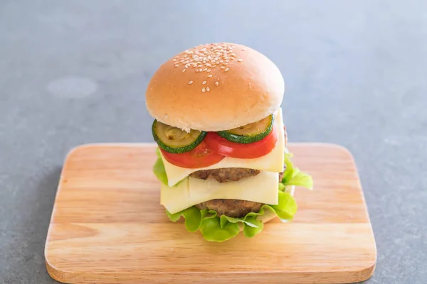 Burger on wood plate  - American food — Stock Photo, Image