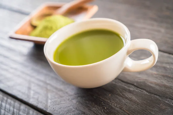 Hot matcha on wood background - soft focus with vintage film filter — Stock Photo, Image