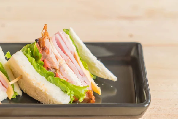 Sandwich on wood background — Stock Photo, Image