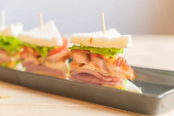 Sandwich on wood background — Stock Photo, Image