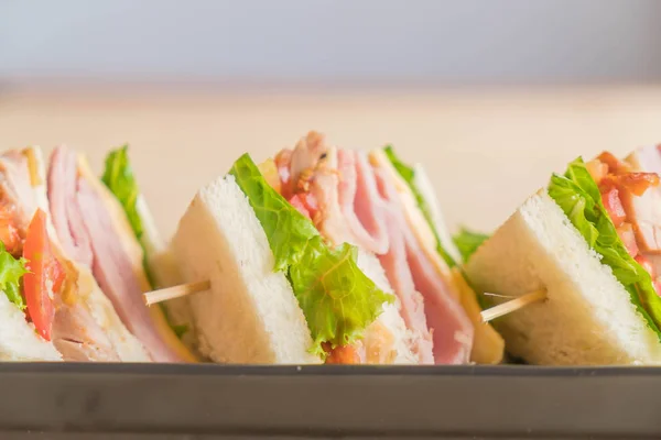 Sandwich on wood background — Stock Photo, Image