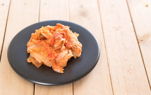 kimchi on wood background - korean food