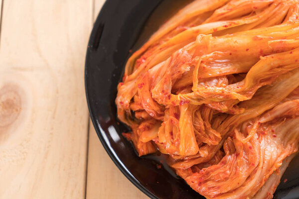 kimchi on wood background - korean food