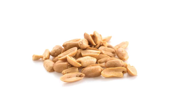 Pečené ořechy na bílém pozadí — Stock fotografie